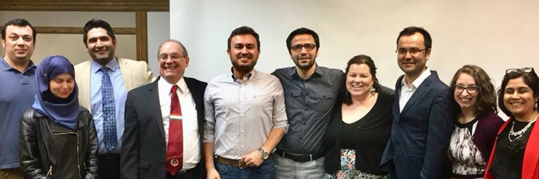 Center for Languages of the Central Asian Region Staff and Faculty smiling for the camera.