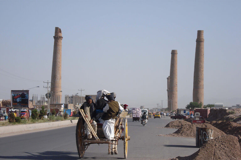 Cart with some people riding into Herat, Afghanistan.