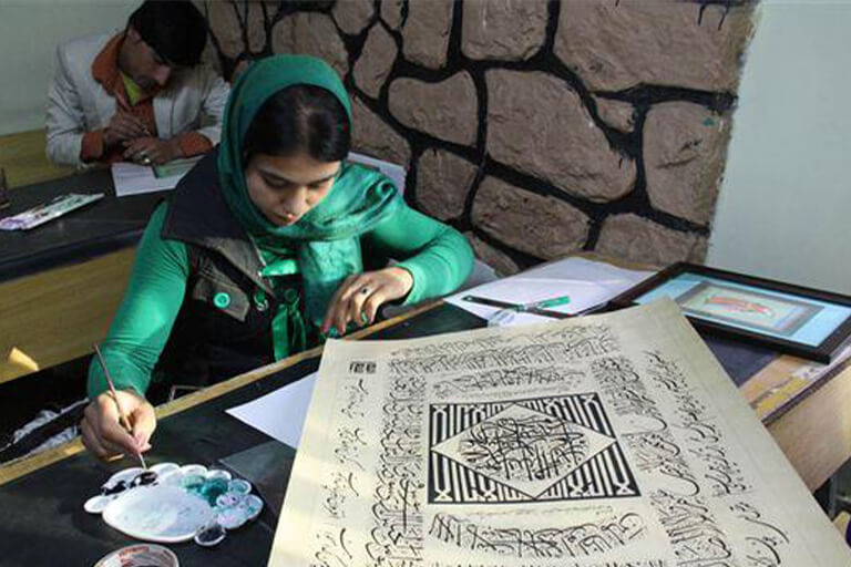 A woman writing on paper.