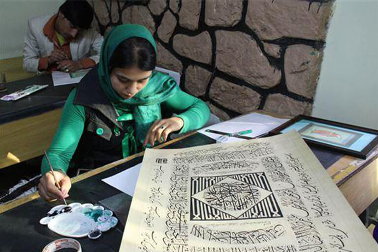 A woman writing on paper.